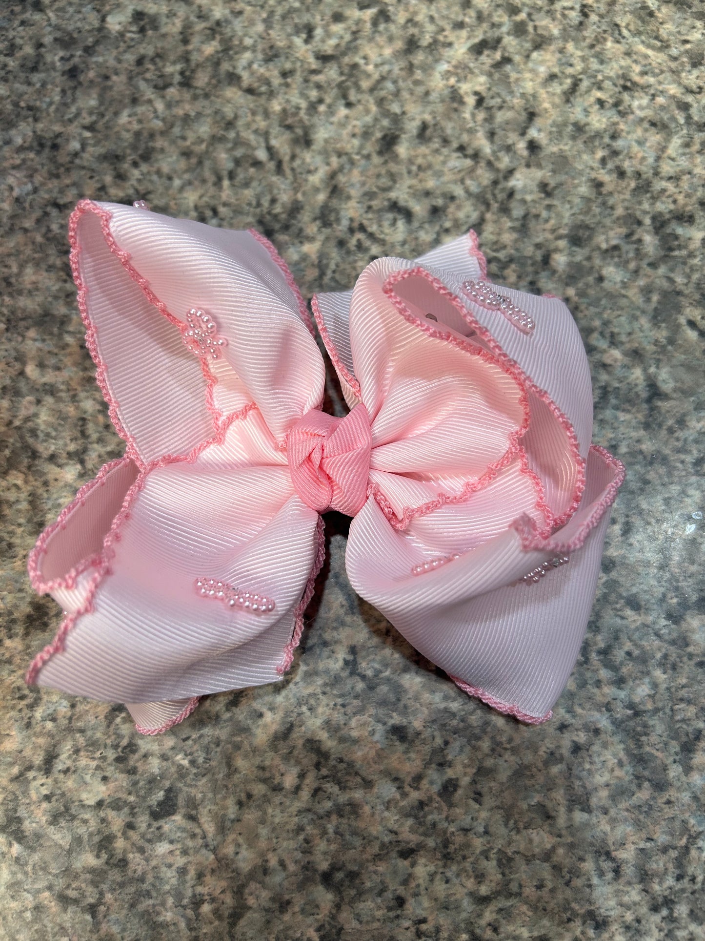 Pink beaded bow